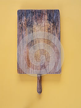 Empty cutting board on yellow