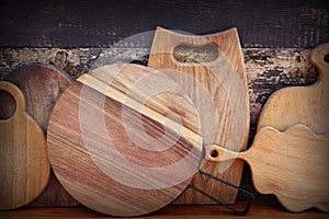 Empty cutting boards on wooden background