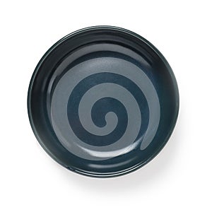 Empty dark blue ceramic bowl or ramekin isolated on a white background. Empty crockery for food design. Clay, ceramics or
