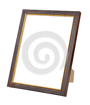 Empty dark brown wooden photo frame with golden border on stand isolated on white background