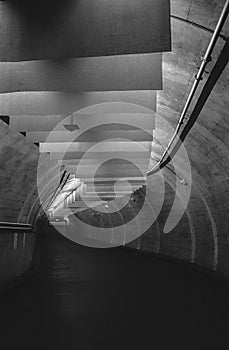 Empty, dark tunnel in an underground parking, shot with analogue black and white film