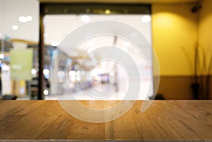 Empty dark wooden table in front of abstract blurred background