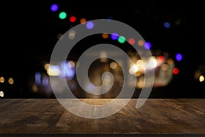 Empty of dark wooden table in front of abstract blurred background of bokeh light . can be used for display or montage your