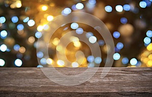 Empty dark wooden table in front of abstract blurred bokeh background of restaurant . can be used for display or montage your