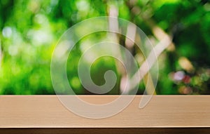 Empty dark wooden table in front of abstract blurred bokeh background of restaurant . can be used for display or montage your