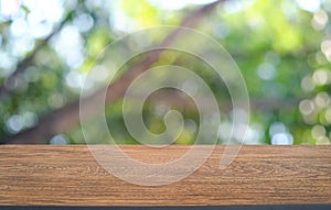 Empty dark wooden table in front of abstract blurred bokeh background of restaurant . can be used for display or montage your