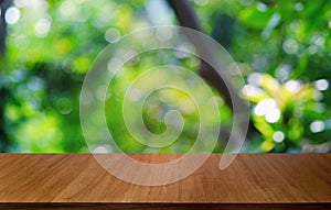 Empty dark wooden table in front of abstract blurred bokeh background of restaurant . can be used for display or montage your