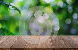 Empty dark wooden table in front of abstract blurred bokeh background of restaurant . can be used for display or montage your