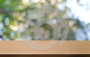 Empty dark wooden table in front of abstract blurred bokeh background of restaurant . can be used for display or montage your