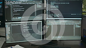 Empty data room with computer screens on desk