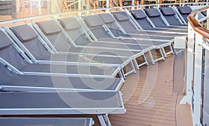 Empty deck chairs on the upper deck of a cruise ship, NOBODY, OUTDOOR, SEA RECREATION CONCEPT