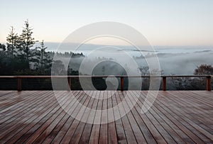 Empty deck overlooking fogcovered countryside