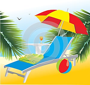 Empty deckchair under an umbrella