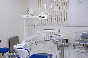 An empty dentistÃ¢â¬â¢s office. Professional equipment of the dentist. photo
