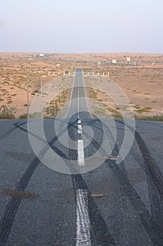 Empty desert downhill road