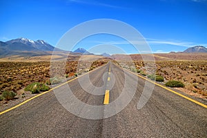 Empty Desert Road in the Los Flamencos National Reserve, Antofagasta Region, Northern Chile photo