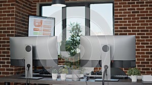 Empty desk with computers in customer service office