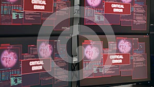 Empty desk with multiple monitors showing system crash warning