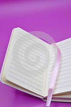 diary on purple background