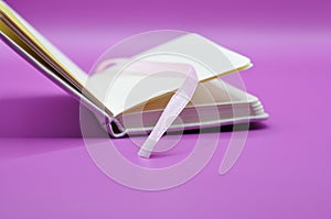 empty diary on purple background