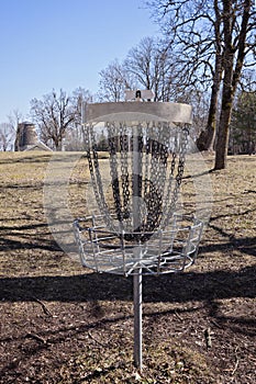 Empty Disc Golf Target on field photo