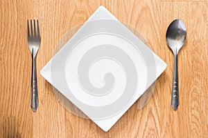 Empty dish, spoon and fork