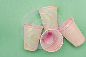 Empty disposable pink plastic cups