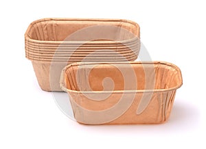Empty disposable rectangular brown paper baking molds