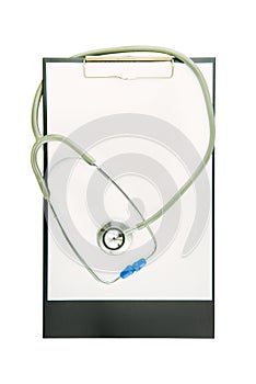 Empty document in a clipboard with stethoscope isolated on white