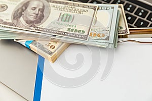 The empty document in statement form and money on the table isolated.