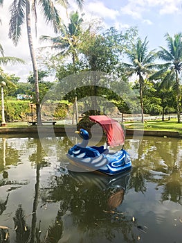 An empty duck-shaped water bike