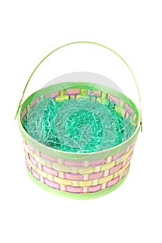 Empty Easter basket with green grass on white