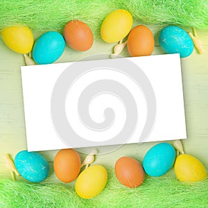 Empty Easter blank card, colored eggs on a backdrop