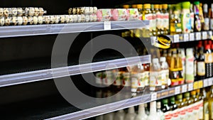 Empty shelves in a grocery store, Hoarding food