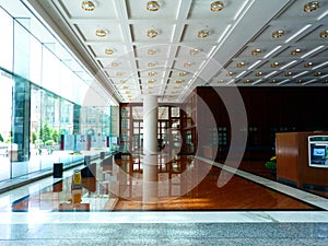 Empty elegant office lobby in downtown Toronto with shiny marble floor