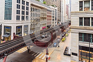 Empty elevated rail tracks in downtown Chicago on a raining spring day