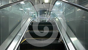 Empty Escalator Ascending to the station