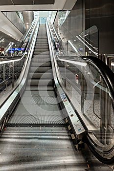 An empty escalator seen from the bottom up