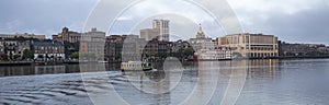 An Empty Ferry Boat Moves on Schedule Crossing the River in Savannah GA