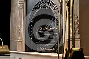 Empty fireplace with metal antique grate close up