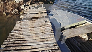 Empty fishing boat moored in the old walkways on the shores