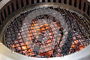 Empty flaming charcoal barbecue grill, ready for raw meat BBQ or