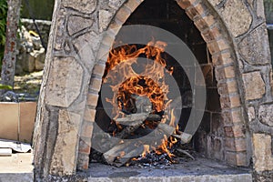 Empty flaming charcoal grill with open fire, ready for product placement