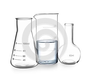 Empty flasks and beaker with water isolated on white