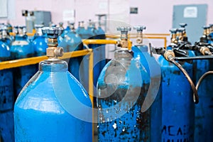 Oxygen cylinder with compressed gas. Blue Oxygen tanks for industry. Liquefied oxygen production. Factory