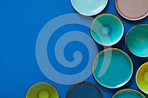 Empty flat and deep plates on a blue background