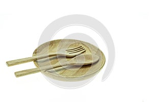 Empty flat wooden dish, fork and spoon isolated on white background