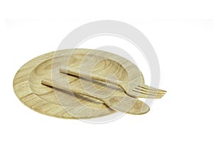 Empty flat wooden dish, fork and spoon isolated on white background