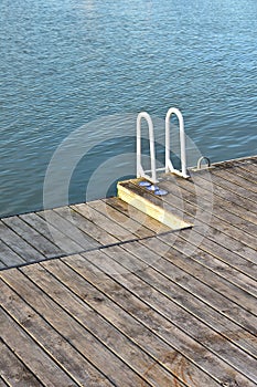 Empty floating pontoon with ladder