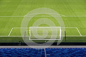 empty football field with natural grass before football match